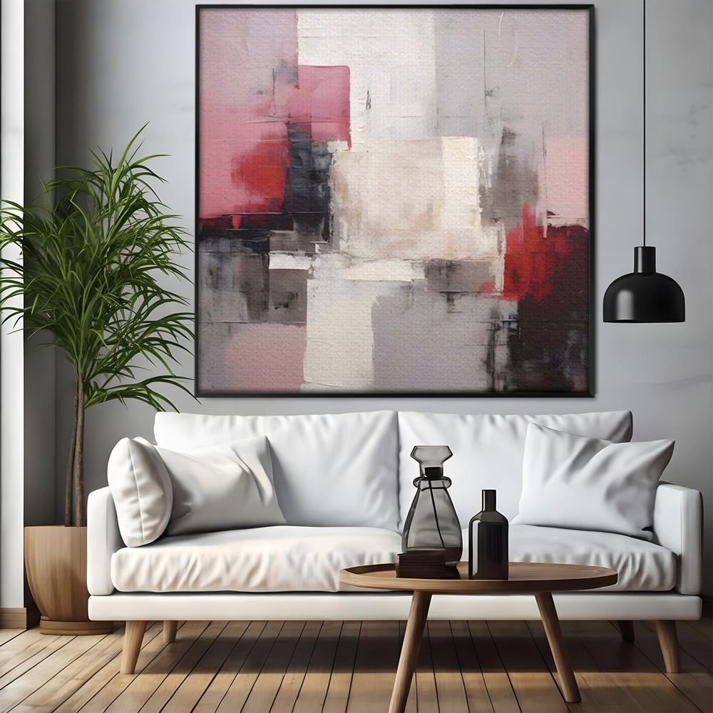 Tablou canvas cu pictura abstracta cu blocuri rosii si negre, in rama de aluminiu negru, pe perete intr-un living